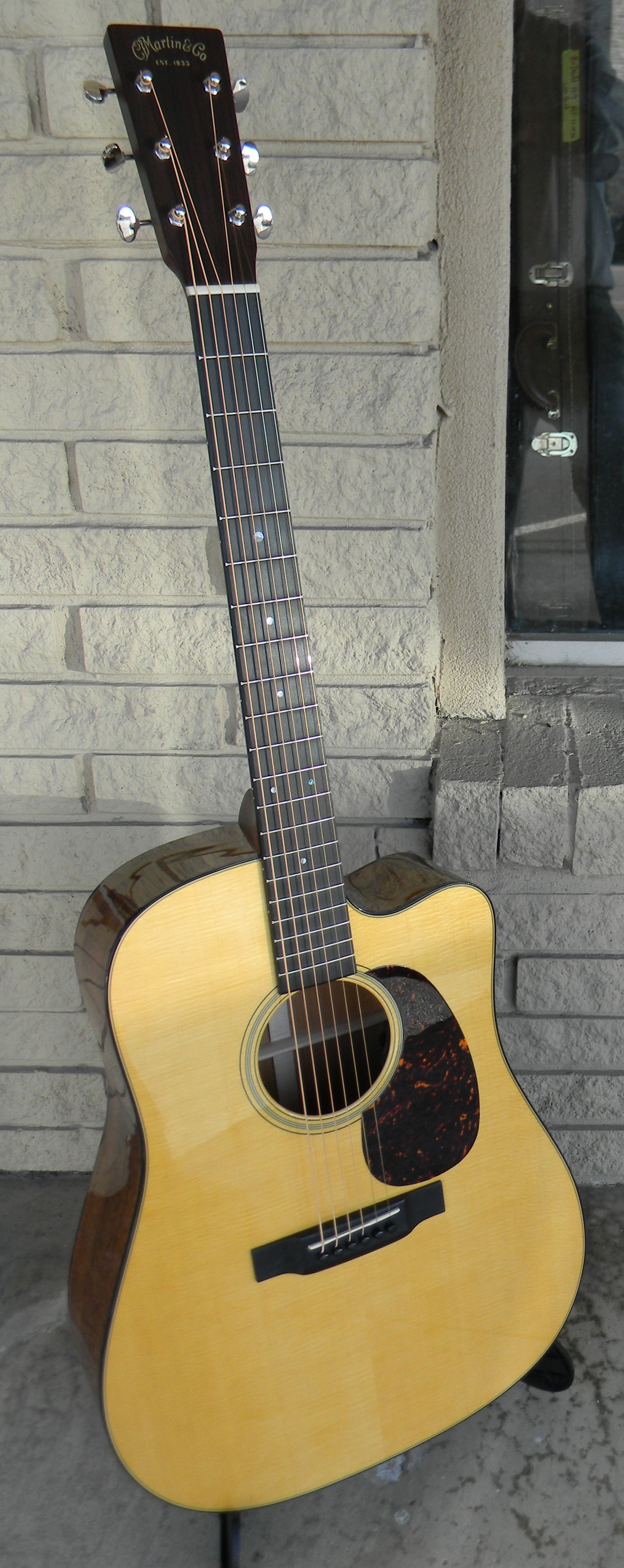 Martin DC -18E. Martin did a redo on the D-18 in 2012, bringing it back to more like a vintage D-18 and the acoustic guitar world applauded.. The recently introduced DC 18E takes that template, adds a vutaway and the coolest pickup system on the planet (no holes in your guitar!), and the results are wonderful. $3.059.00